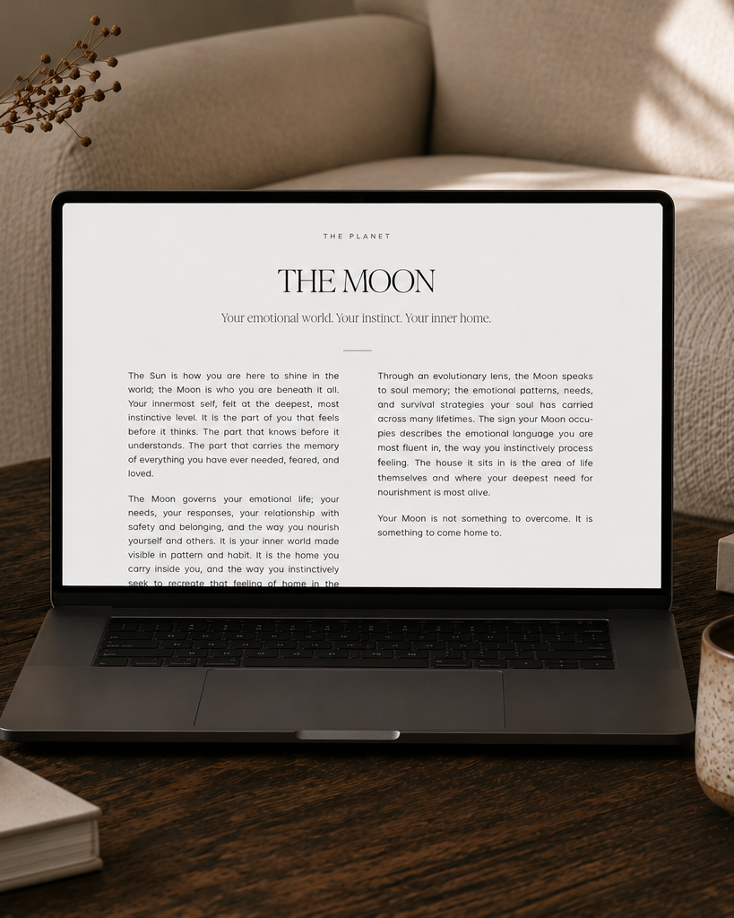 The astrology guide open on a laptop, showing a page about The Moon